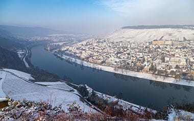 Scenic view over the Moselle river covered in winter snow Scenic view over the Moselle river covered in winter snow